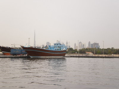 A large dhow moored on the Dubai creek represents the old, with new Dubai in the background